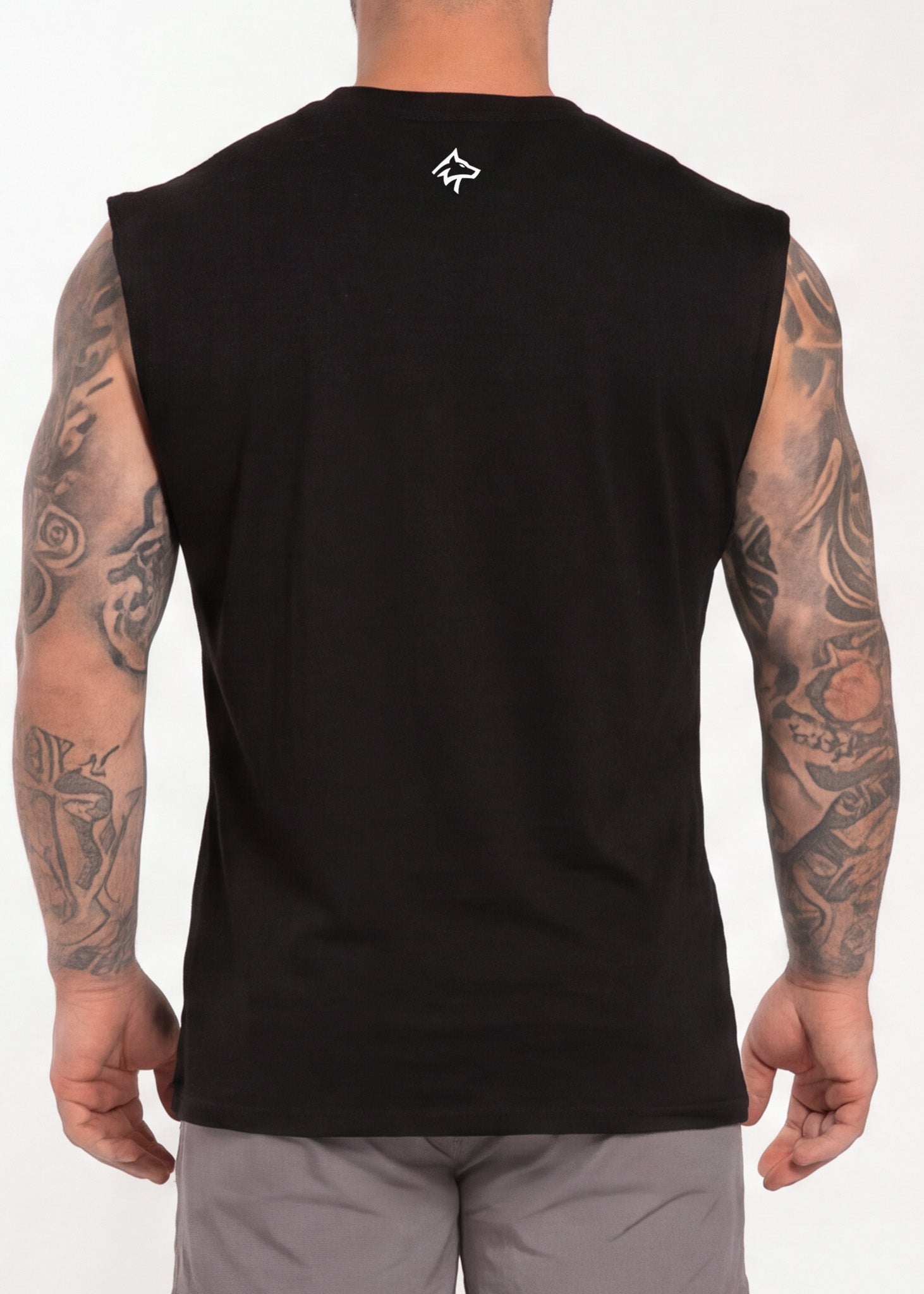 Black sleeveless gym tank top with small white logo on back, worn by tattooed man for workout or training