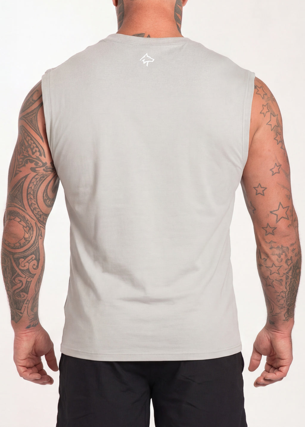 Men's gray sleeveless gym tank top with small logo, worn by tattooed model for workout or training