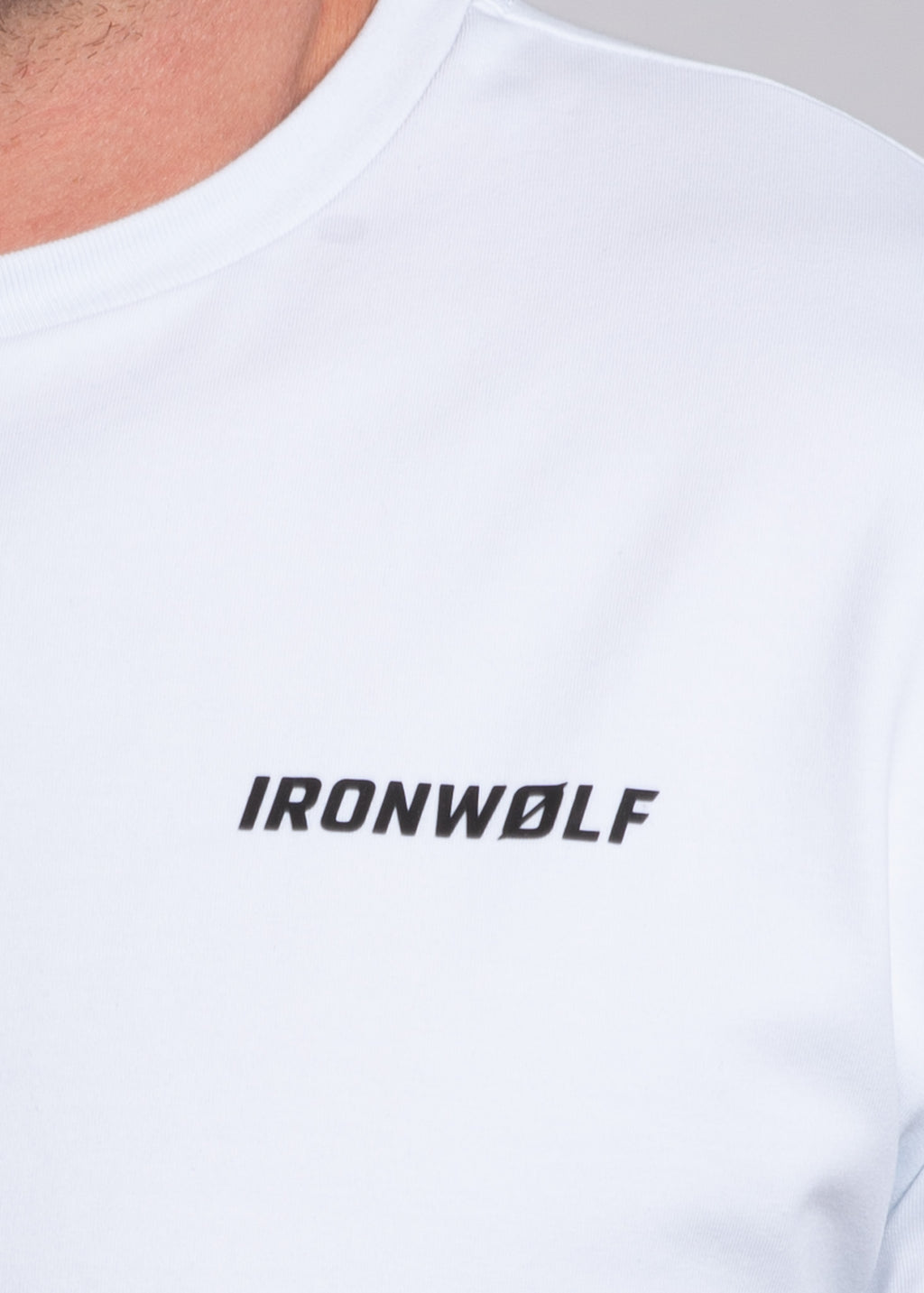White gym t-shirt with IRONWØLF logo, designed for training and active lifestyle comfort.