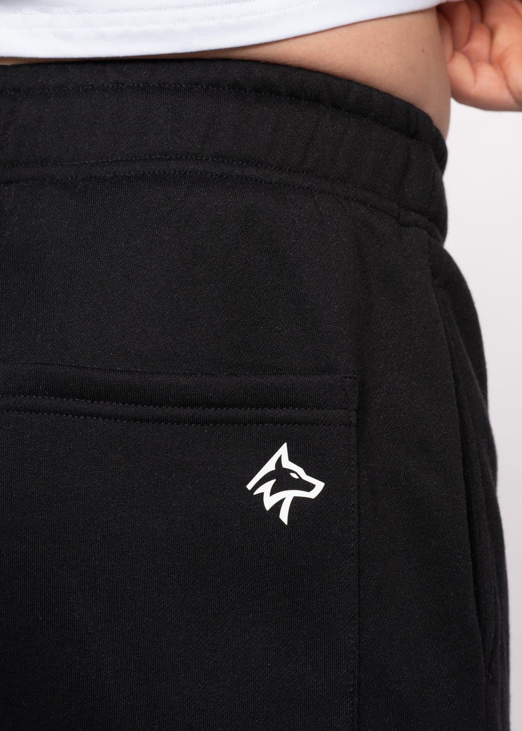 Black gym sweatpants with white wolf logo, ideal for training and active lifestyle