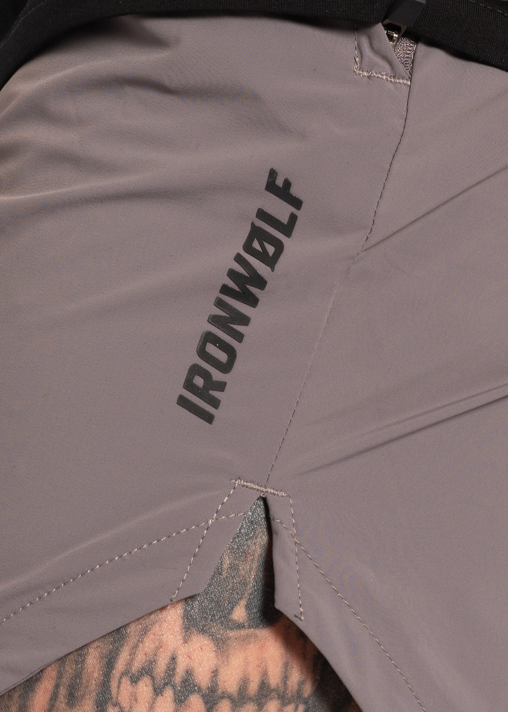 Grey IRONWØLF gym shorts with bold branding, designed for high-performance training and comfort.