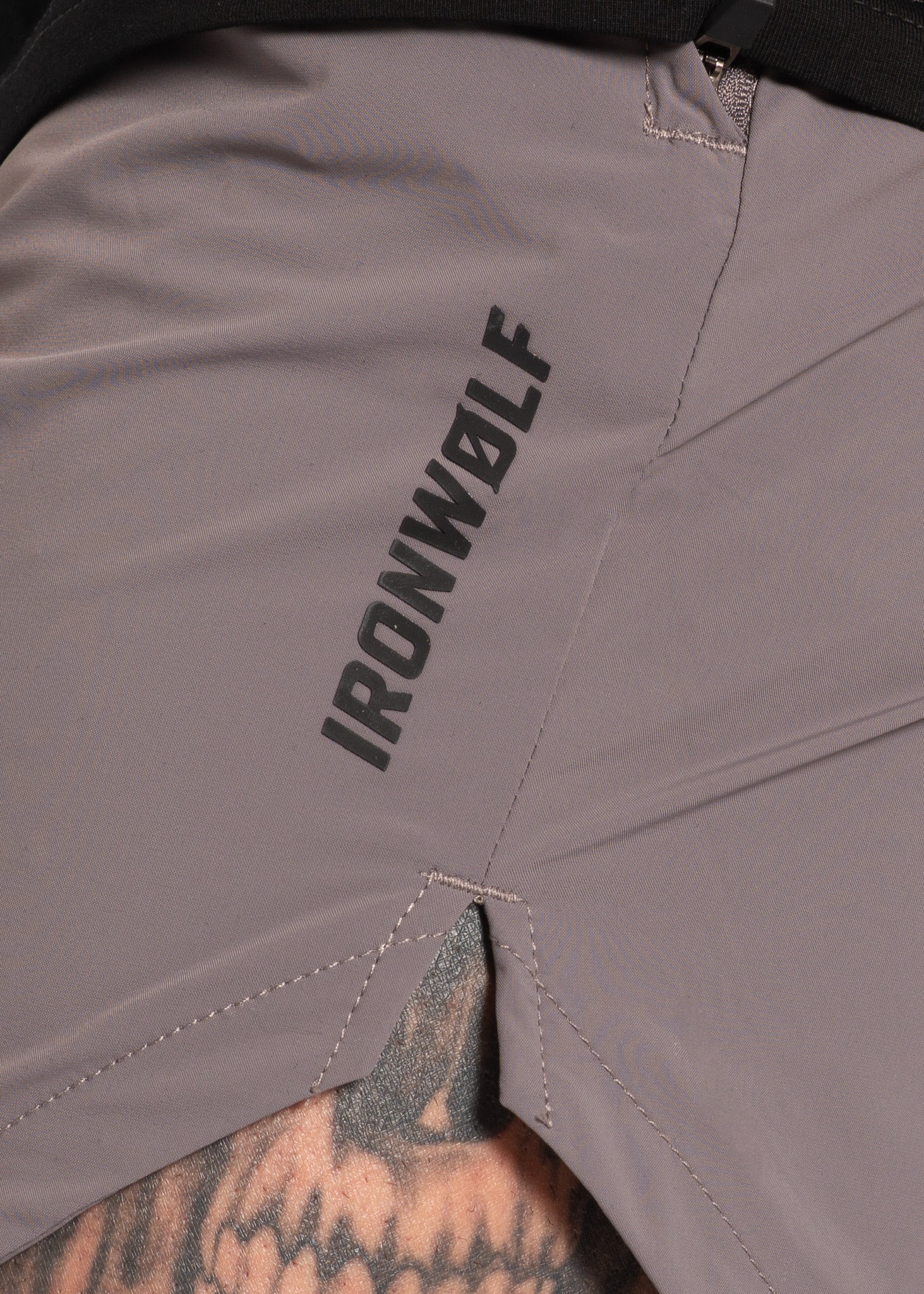 Grey IRONWØLF gym shorts with bold branding, designed for high-performance training and comfort.