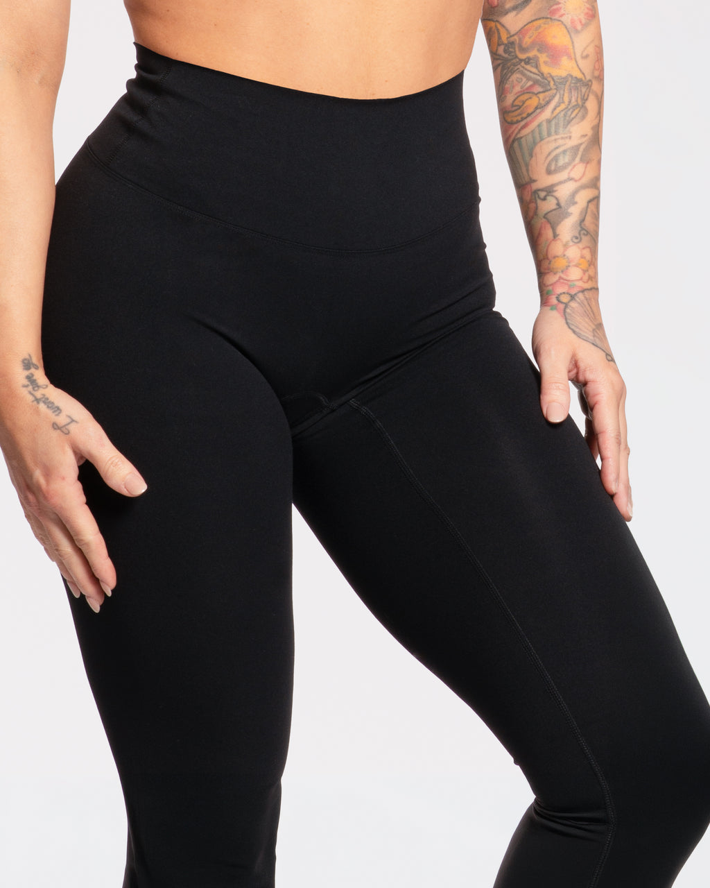 Black high-waisted gym leggings for women, designed for comfort and movement during workouts