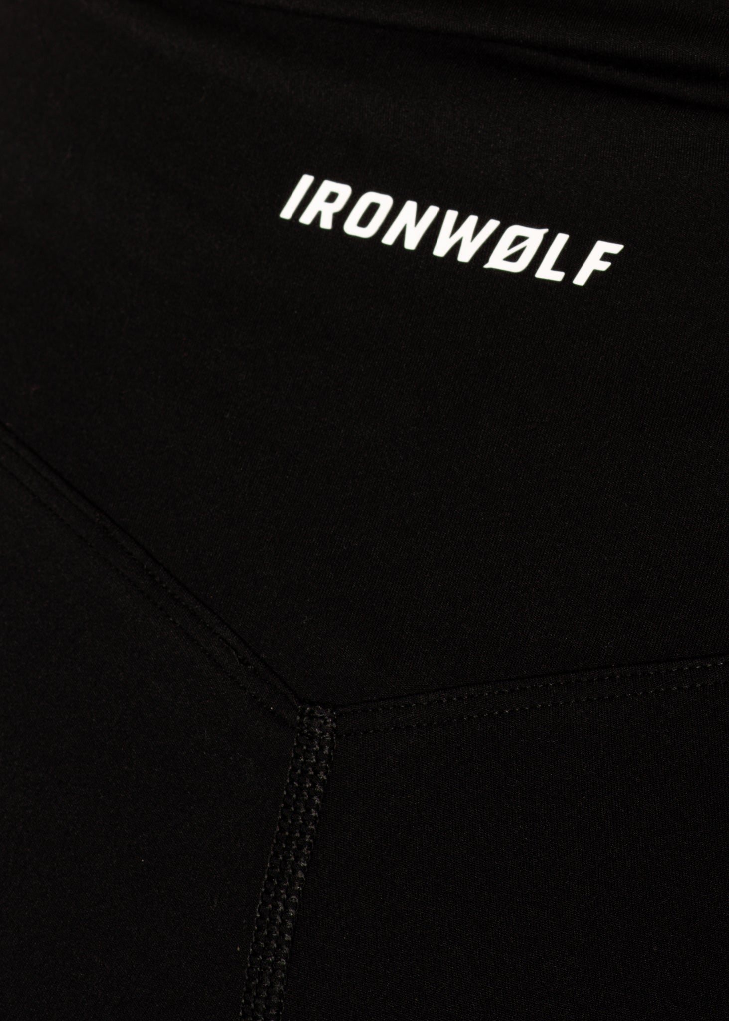Black performance activewear with IRONWØLF logo, designed for gym training and movement