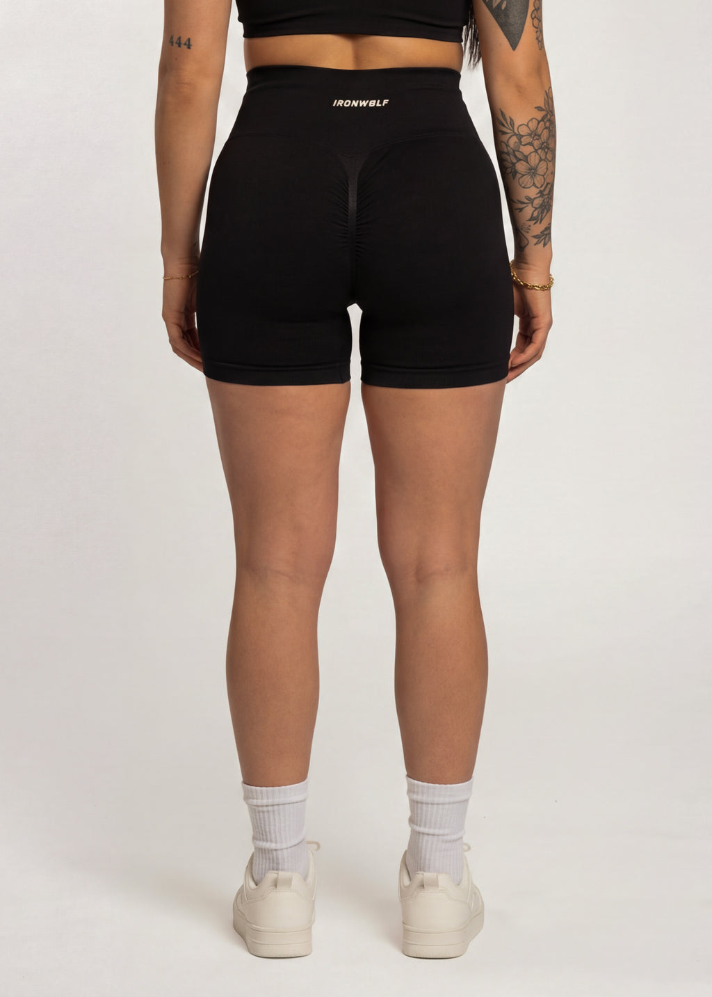 Black high-waisted gym shorts with IRONWØLF logo, designed for training and comfort