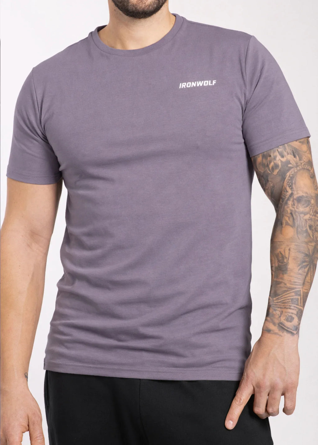 Man wearing purple IRONWOLF gym t-shirt with chest logo, ideal for training and active lifestyle