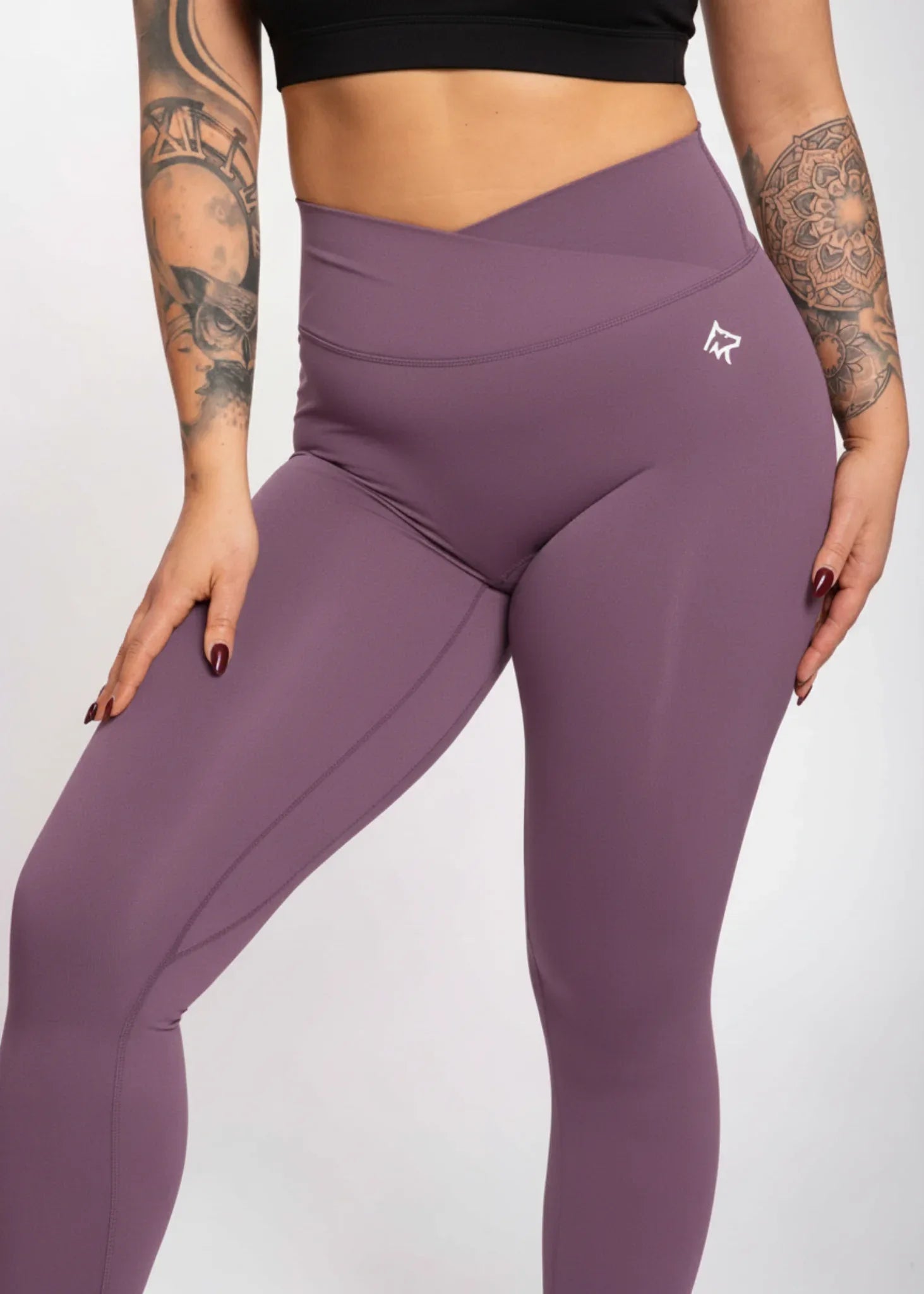 Purple high-waisted gym leggings with seamless design, perfect for training and active lifestyle