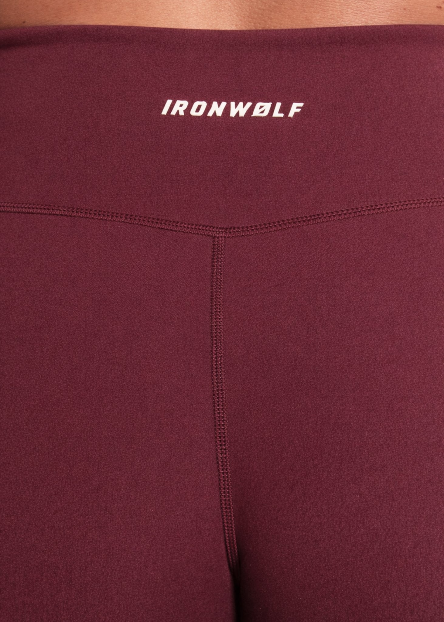 Maroon high-performance gym leggings with IRONWØLF logo, designed for comfort and movement during training.